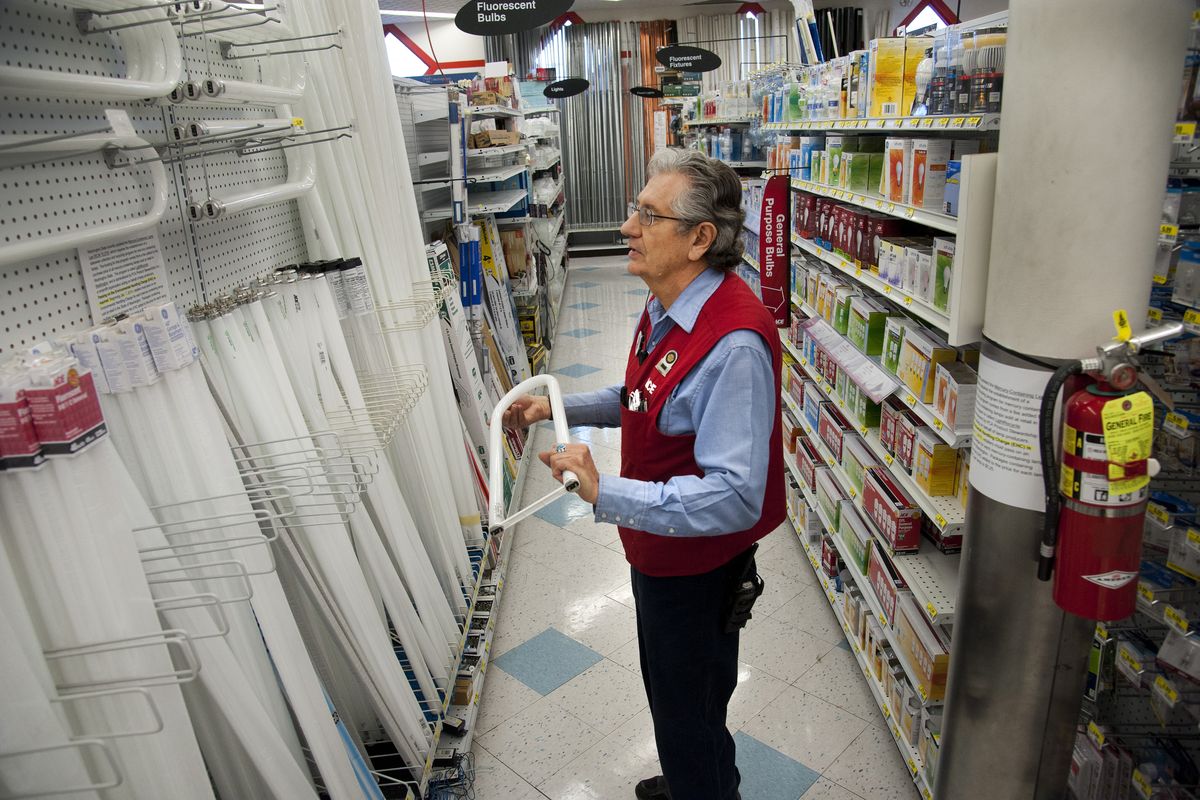 John Bybee, employee at Ace Hardware at Sullivan Road and Sprague Avenue, stands in the fluorescent bulb aisle on Wednesday. The store is one of 130 sites in Washington that will recycle fluorescent lights and other mercury-containing lights for free. (Dan Pelle)