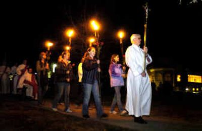 
Deacon Dave Luksch, right, leads a candlelight vigil at  Sacred Heart of Mary Church in Boulder, Colo., Friday in remembrance of aborted fetuses. The church will bury the ashes of up to 1,000 aborted fetuses in its cemetery this weekend.
 (Associated Press / The Spokesman-Review)