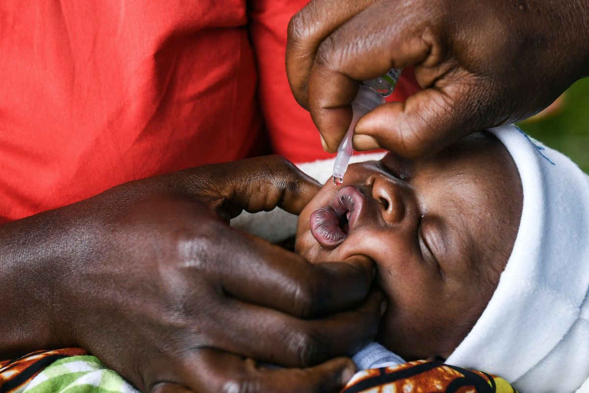 FILE - A baby receives a polio vaccine during the Malawi Polio Vaccination Campaign Launch in Lilongwe, Malawi, on March 20, 2022. The World Health Organization said on Thursday, April 28, 2022 that Africa is seeing a surge of outbreaks of preventable diseases as a result of disruptions caused by the coronavirus pandemic. (Thoko Chikondi)