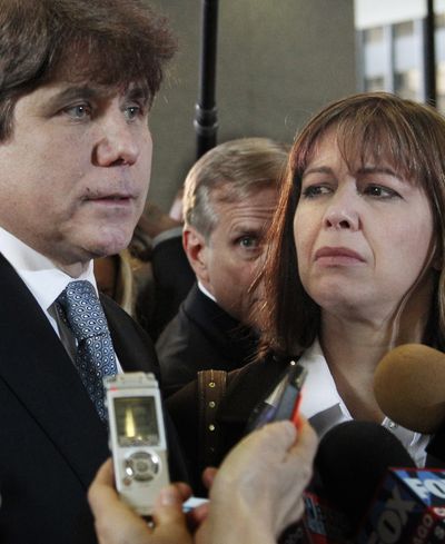 Former Illinois Gov. Rod Blagojevich, with his wife Patti, speaks to reporters after being sentenced. (Associated Press)