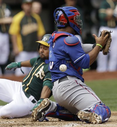 Athletics’ Coco Crisp scores one of his team’s two runs on Thursday. Oakland has lost six of its last eight. (Associated Press)