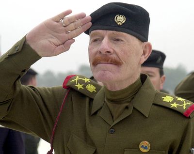 In this 2002 photo, Izzat Ibrahim al-Douri salutes during a ceremony in Baghdad. (Associated Press)