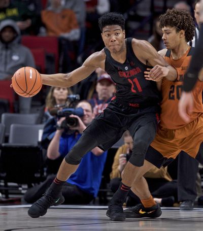 Gonzaga forward Rui Hachimura, left, posts up against Texas forward Jericho Sims during the second half of an NCAA college basketball game in the Phil Knight Invitational tournament in Portland, Ore., Sunday, Nov. 26, 2017. (Craig Mitchelldyer / Associated Press)