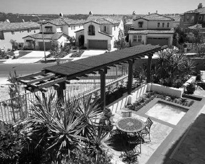 
This photo taken in 2005 and provided by Pardee Homes shows solar panels as part of a solar trellis in the yard of a former model home in one of the company's developments in San Diego. 
 (Associated Press / The Spokesman-Review)