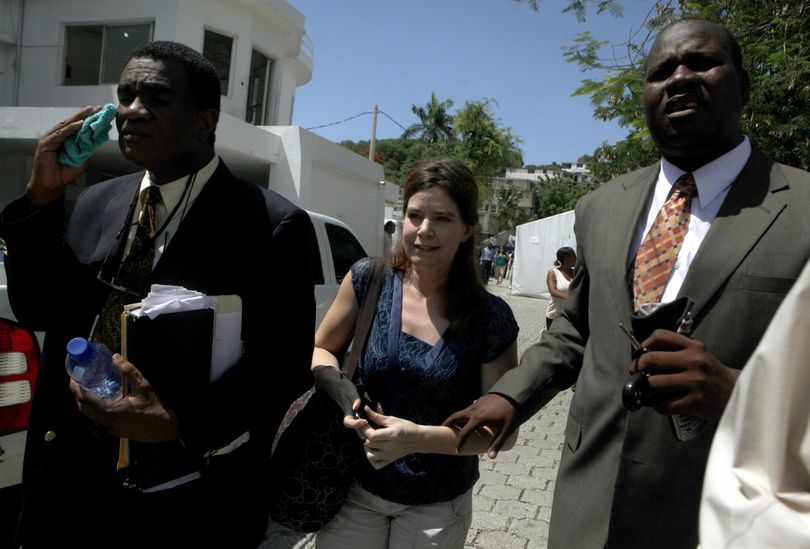 U.S. missionary Laura Silsby, center, leaves a courthouse in Port-au-Prince, Monday, May 17, 2010. Silsby, the last of 10 Americans detained while trying to take 33 children out of Haiti following the Jan. 12 earthquake was released after a judge convicted her and sentenced her to the time she had already served in jail. (Esteban Felix / Associated Press)