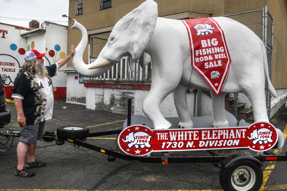 Pat Conley gives a pat to “Elie the Elephant” after unloading her in the White Elephant parking lot on Division Street in Spokane. The structure was built for the valley store, but just recently arrived and won