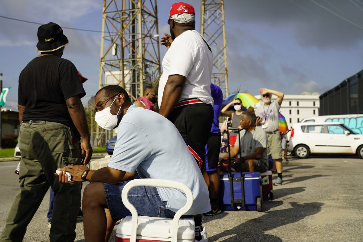 In the aftermath of Hurricane Ida people lining up for food and ice at a distribution center Wednesday, Sept. 1, 2021, in New Orleans, La.  (Eric Gay)