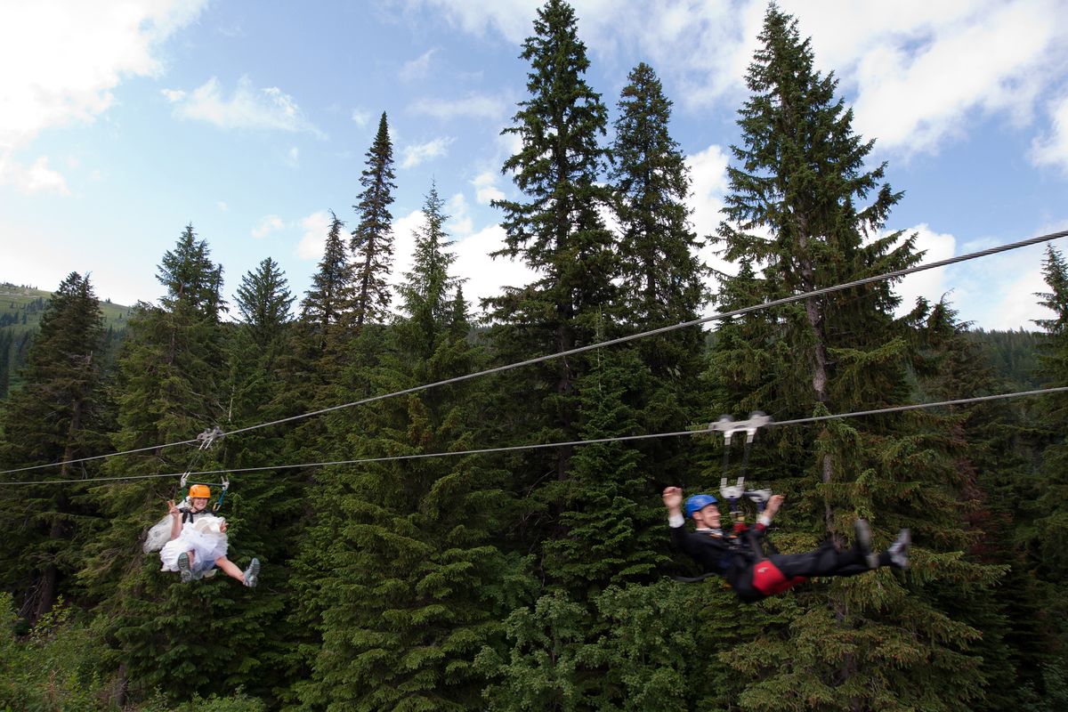 Amy and John Lilly were married July 14 at Schweitzer Mountain Resort. In a spontaneous decision, they decided to race down the lines right after the ceremony, still in their wedding wear. (Courtesy of On the edge Weddings)