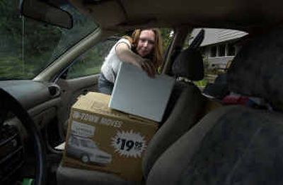Stephanie Conn, 19, loads her car with moving boxes in her driveway in Spokane Valley. Conn, a Running Start student, will graduate from Eastern Washington University this year. Conn is leaving this weekend for a job at the University of Washington in Seattle.Stephanie Conn, 19, loads her car with moving boxes in her driveway in Spokane Valley. Conn, a Running Start student, will graduate from Eastern Washington University this year. Conn is leaving this weekend for a job at the University of Washington in Seattle.
(Liz Kishimoto/Liz Kishimoto/ / The Spokesman-Review)