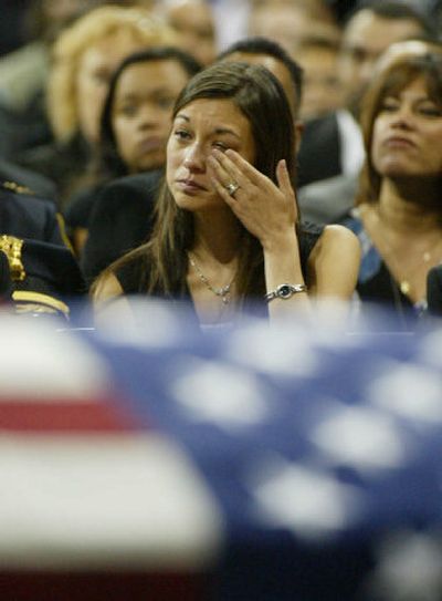 
Amber Noel-Du, Joselito Barber's fiancée, weeps during his memorial service in Seattle. 
 (Associated Press / The Spokesman-Review)