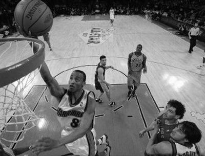 
Monta Ellis of Golden State scores two of his 28 points for the Sophomores in their 155-114 victory over the Rookies. 
 (Associated Press / The Spokesman-Review)