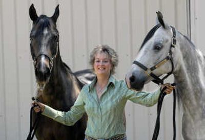 
Susan Glover-Neff shows off her horses, Just Plain Jake and Reckless, earlier this month at their ranch in Colbert. 
 (Brian Plonka / The Spokesman-Review)