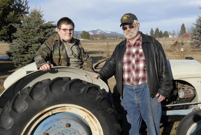 Leo Shollenberger and his grandfather, Leo Shollenberger, pose for a picture behind their home near Newman Lake on March 3.   (J. BART RAYNIAK / The Spokesman-Review)