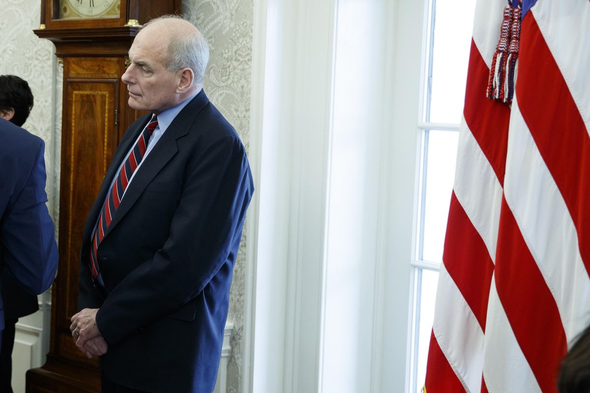 White House Chief of Staff John Kelly listens during a meeting between President Donald Trump and campaign volunteer Shane Bouvet on Friday, Feb. 9, 2018, in the Oval Office of the White House in Washington. (Evan Vucci / AP)