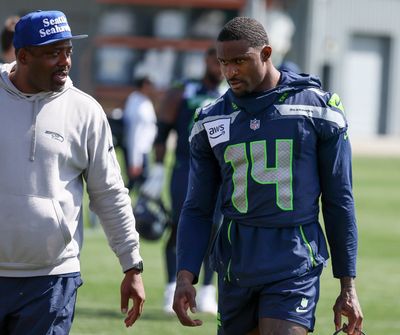 Frisman Jackson and DK Metcalf make their off the field after practice on the first day of the three-day Seattle Seahawks minicamp, on Tuesday, June 11, 2024, at the Virginia Mason Athletic Center in Renton, Washington.  (Kevin Clark/Seattle Times)