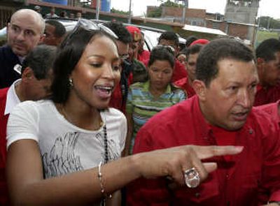 
British supermodel Naomi Campbell talks to Venezuela's President Hugo Chavez  in Caracas in this Oct. 31 file photo. Associated Press
 (Associated Press / The Spokesman-Review)