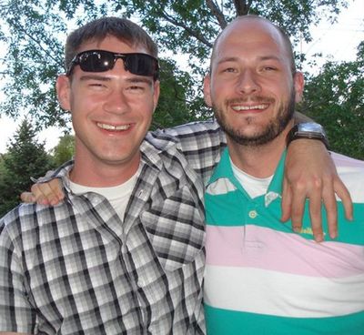 This family photo provided via The Kalamazoo Gazette shows Army Capt. Drew E. Russell, left, with his brother James, in Colorado, just before being deployed to Afghanistan in the summer of 2011. Russell and Army Capt. Joshua Lawrence were inside a small command post on an Afghan army base, when an exploding grenade was followed in seconds by bursts of gunfire. Before any of the Americans could raise a hand to defend themselves, Lawrence was dead, one 5.56mm bullet to the head, and Russell was dying, shot three times in the back. (Russell Family / Russel Family Via The Kalamazoo Gazette)