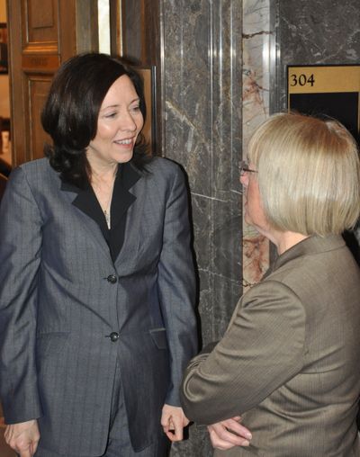 OLYMPIA -- U.S. Sens. Maria Cantwell (left) and Patty Murray meet in the wings of the state Senate on Feb. 20, 2012. Cantwell was coming out of the Senate Democratic Caucus after talking to its members and Murray was going in. They were in the state on the President's Day recess, and both stopped by the state Capitol to talk with fellow Democrats. (Jim Camden)