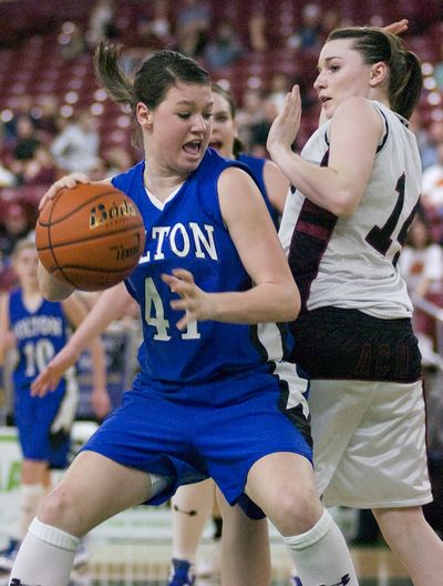 Colton’s Mollie Kramer drives to the basket past ACH’s Sarah Gloyn. (Associated Press)