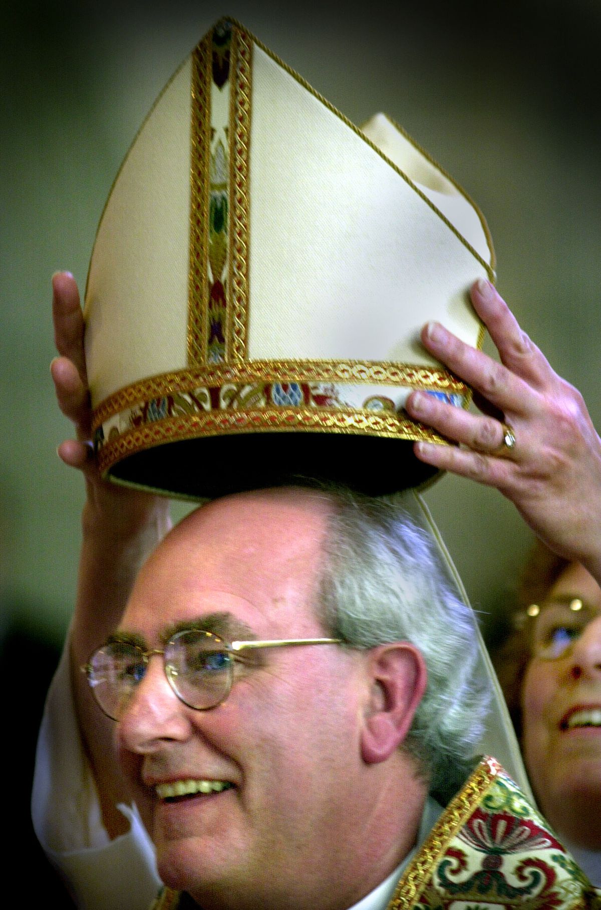 Bishop James E. Waggoner receives his miter from the Rev. Ann Howard during his installment ceremony at Spokane’s Cathedral of St. John the Evangelist in fall 2000. (Spokesman-Review photo archives)