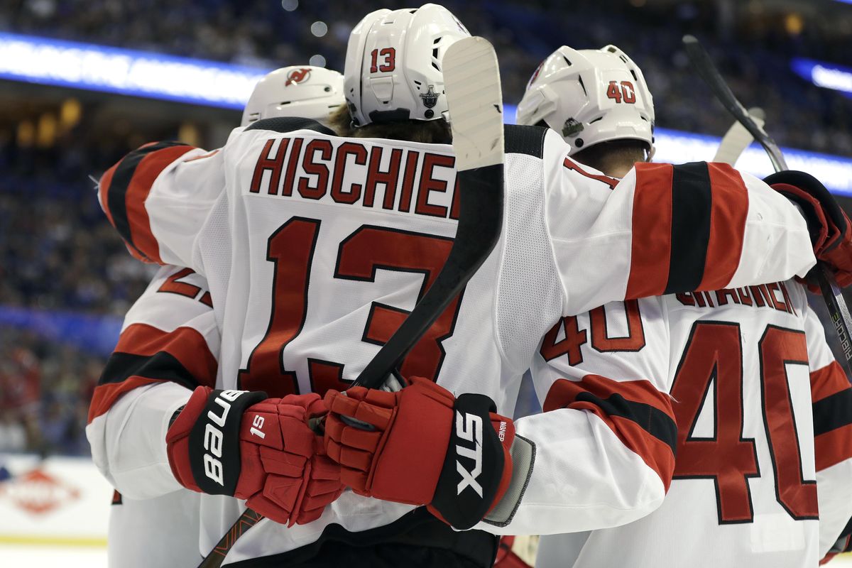 New Jersey Devils center Nico Hischier (13) celebrates his goal against the Tampa Bay Lightning with right wing Michael Grabner (40) during the first period of Game 2 of an NHL first-round hockey playoff series Saturday, April 14, 2018, in Tampa, Fla. (Chris O’Meara / Associated Press)