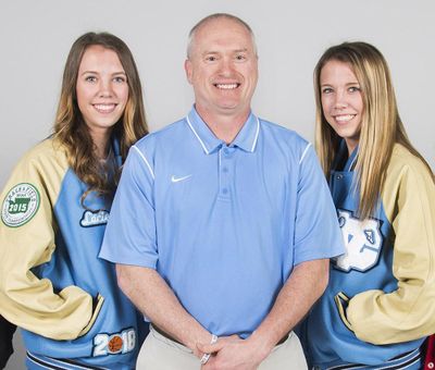 Lacie Hull, left, and twin sister Lexie Hull, right, with CV coach Freddie Rehkow, will try out for the USA women’s basketball U17 national team. (Dan Pelle / The Spokesman-Review)