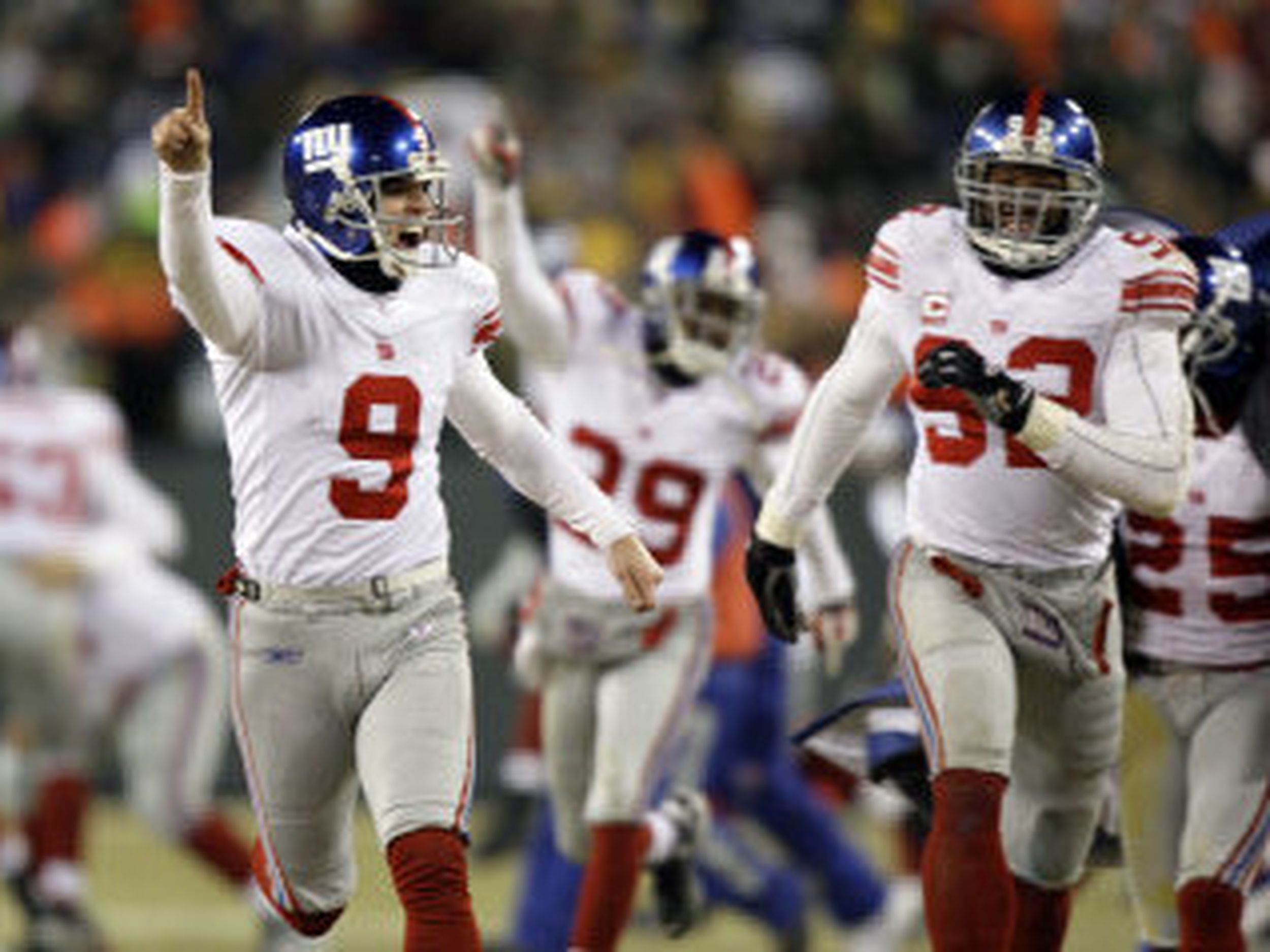 New York Giants Plaxico Burress celebrates his first quarter