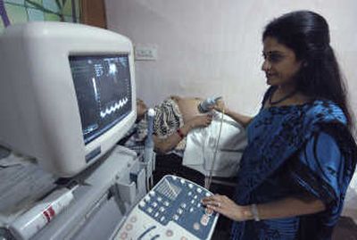 
Dr. Nayna Patel examines a surrogate mother Dec. 17 at Kaival Hospital in Anand, India. Associated Press
 (Associated Press / The Spokesman-Review)