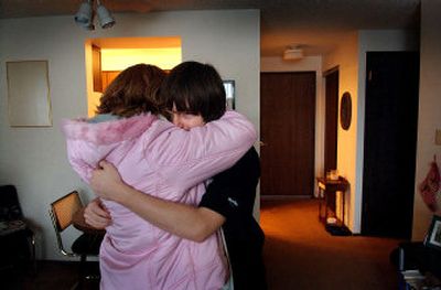 
Christopher Bishop, 14, hugs his mother, Heather Johnson, on Thursday at Johnson's mother's Medical Lake apartment, where Christopher will spend the night. Christopher cannot stay with his family at their Fairchild Air Force Base home because of his behavioral problems. 
 (Photos by Brian Plonka/ / The Spokesman-Review)