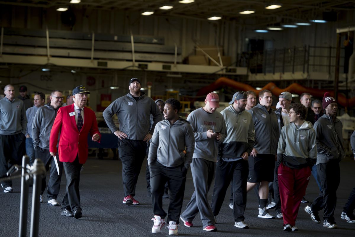 WSU players tour the USS America before the 2016 Holiday Bowl on Saturday, Dec. 24, 2016, at Naval Base San Diego in San Diego, Calif. (Tyler Tjomsland / The Spokesman-Review)