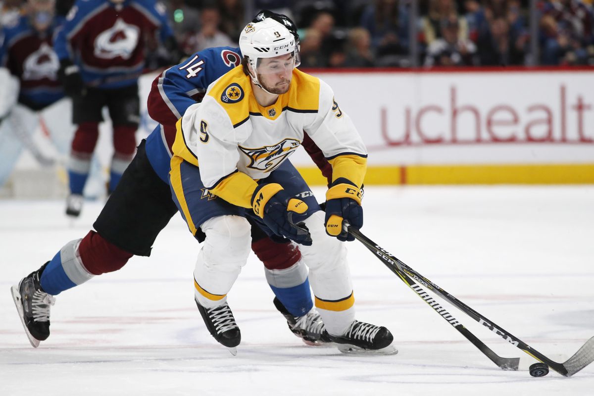 In this March 4, 2018, file photo, Nashville Predators left wing Filip Forsberg collects the puck in front of Colorado Avalanche left wing Blake Comeau during the third period of an NHL hockey game in Denver. (David Zalubowski / Associated Press)