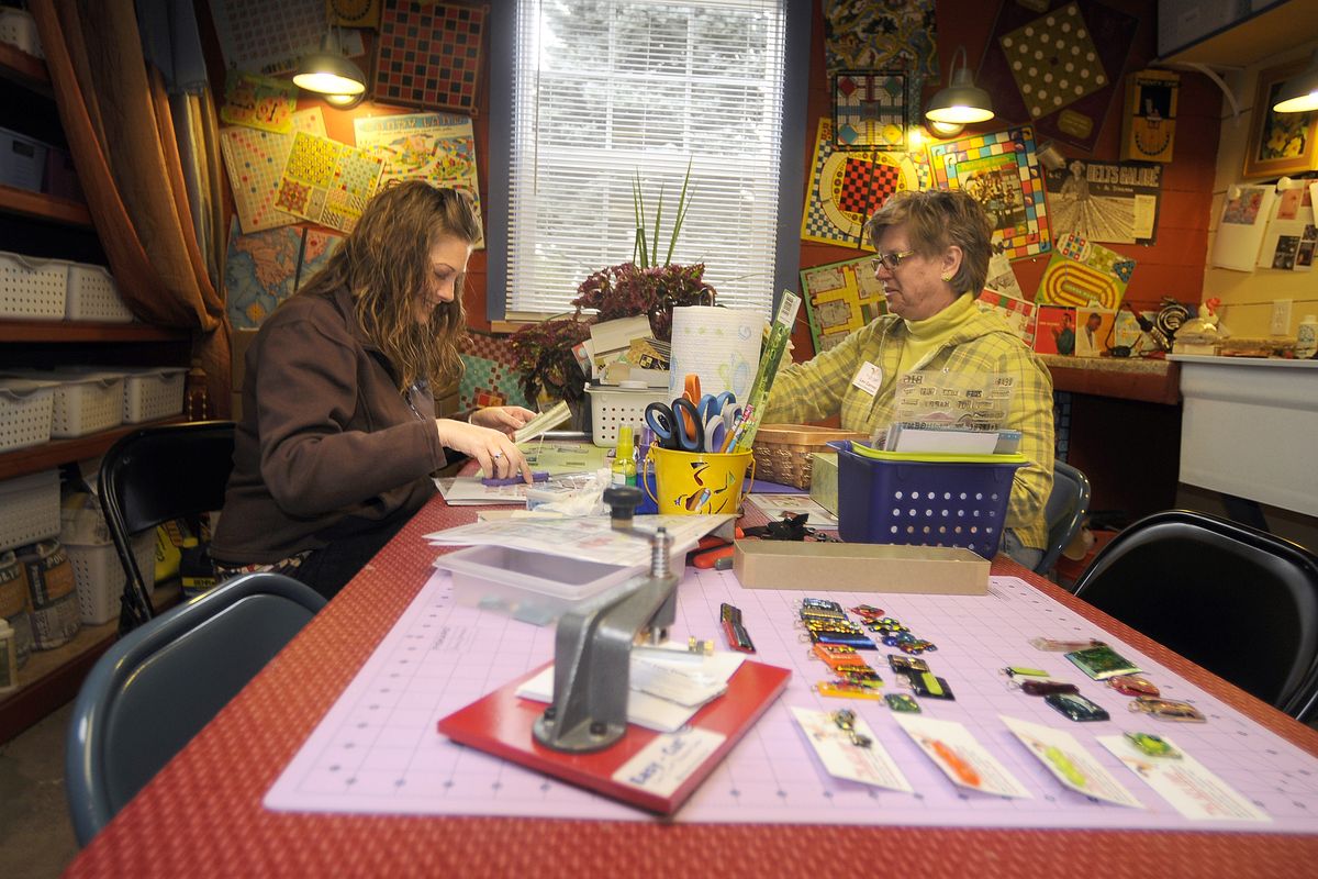 Breelyn Boe, left, and Carver work on art projects at the Art Coop. (The Spokesman-Review)