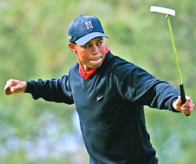 
Tiger reacts just before his eagle putt fell in on the ninth hole during the final round of the Buick Invitational golf tournament. 
 (Associated Press / The Spokesman-Review)