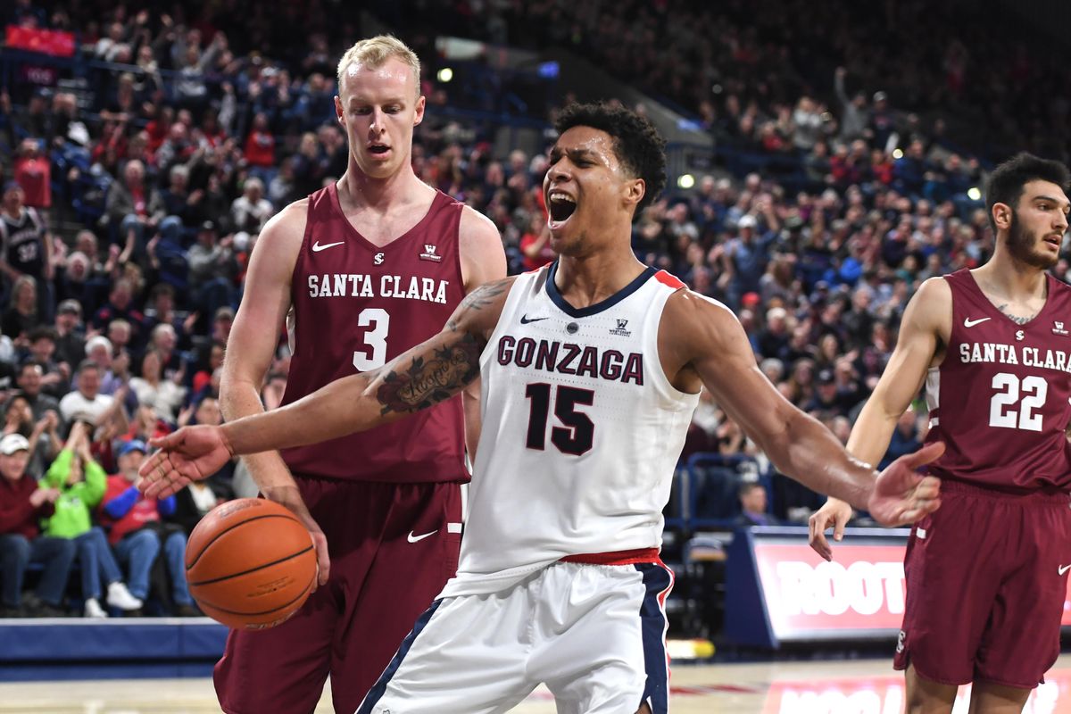 Gonzaga forward Brandon Clarke celebrates his dunk after an assist from teammate Josh Perkins against Santa Clara forwards Henrik Jadersten (3) and Josh Martin, Saturday, Jan. 5. 2019, in the McCarthey Athletic Center. (Dan Pelle / The Spokesman-Review)