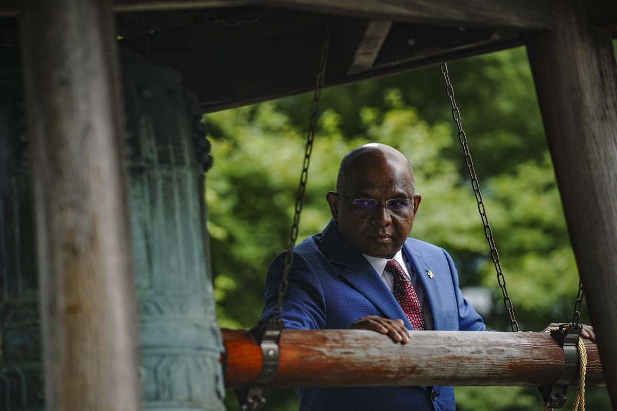 Abdulla Shahid, President of the seventy-sixth session of the United Nations General Assembly (UNGA), rings the Peace Bell during ceremony marking the 40th Anniversary of the International Day of Peace, Friday Sept. 17, 2021 at U.N. headquarters. The U.N.G.A. is going to rely on an honor system that world leaders be vaccinated to speak at next week's meeting. Shahid said that they'll simply attest to being vaccinated by swiping their ID badges.  (Bebeto Matthews)