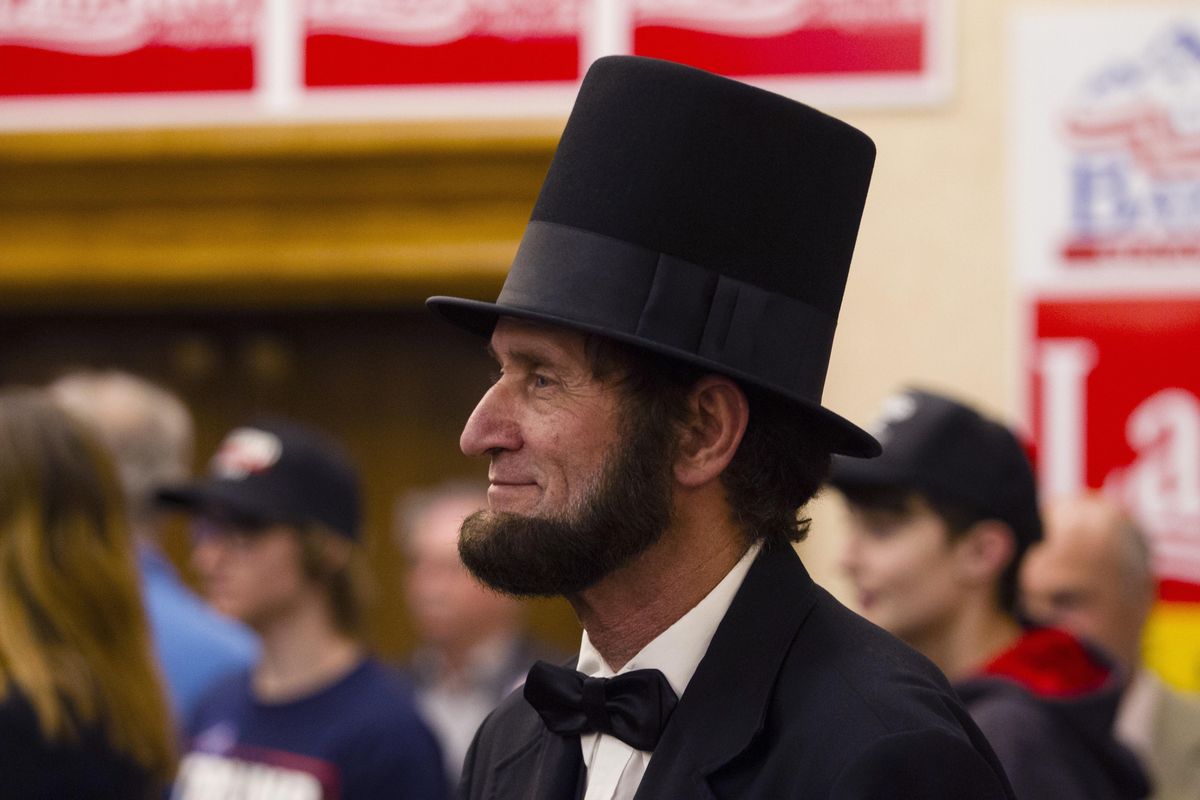 Living history presenter Skip Critell dressed as President Abraham Lincoln listens to a speech at the Idaho GOP Election Night Party at the Riverside Hotel in Boise, Idaho, on Tuesday, Nov. 8, 2016. (Otto Kitsinger / AP)