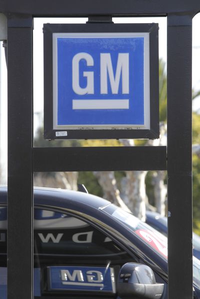 General Motors vehicles are shown for sale at a dealership in Redwood City, Calif., in November. General Motors says sales of cars and trucks in the U.S. rose 6.3 percent last year as a strong lineup of new models helped the company make a comeback from its 2009 bankruptcy.  (Associated Press)