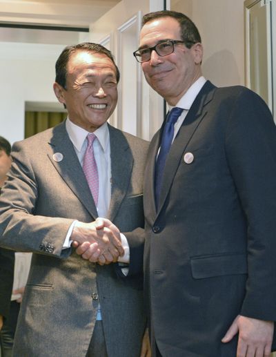 Japanese Finance Minister Taro Aso, left, and U.S. Treasury Secretary Steven Mnuchin meet for talks ahead of the G-20 Finance Ministers meeting in Baden-Baden, southern Germany, Friday, March 17, 2017. (Franziska Kraufmann / Associated Press)