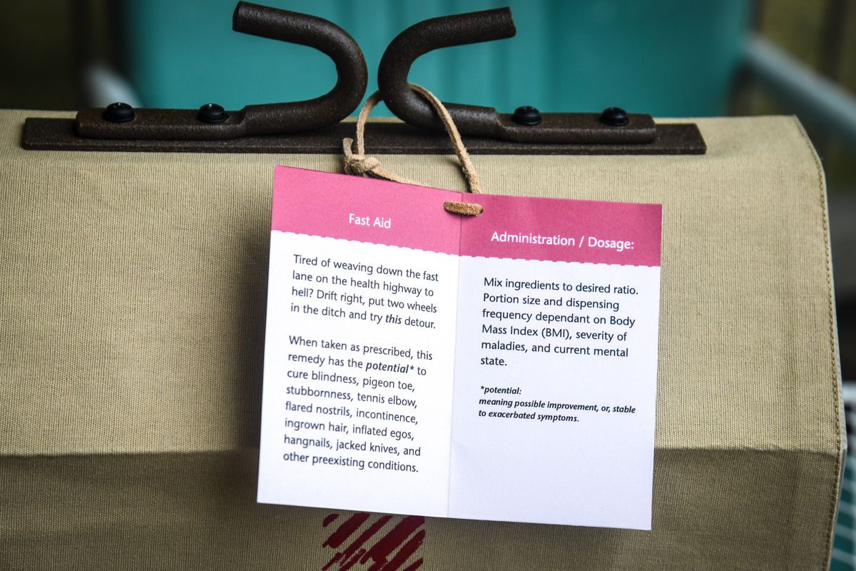 The dosage instructions accompany the “Fast Aid” kit made for artist Ken Spiering, creator of the red wagon in Riverfront Park.  (DAN PELLE/The Spokesman-Review)