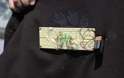 
The front of a sweat shirt bearing a computer circuit board and wiring worn by Massachusetts Institute of Technology sophomore Star Simpson, 19, is shown at a news conference Friday.
 (Associated Press / The Spokesman-Review)