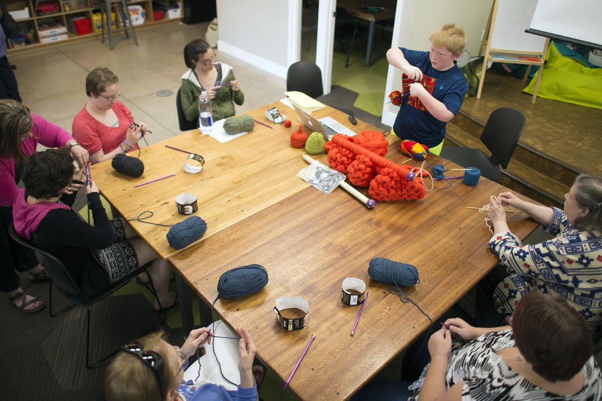 Jack Kashork, 10, teaches a knitting class at the Spark Center, Thursday, May 26, 2016. (Colin Mulvany / The Spokesman-Review)