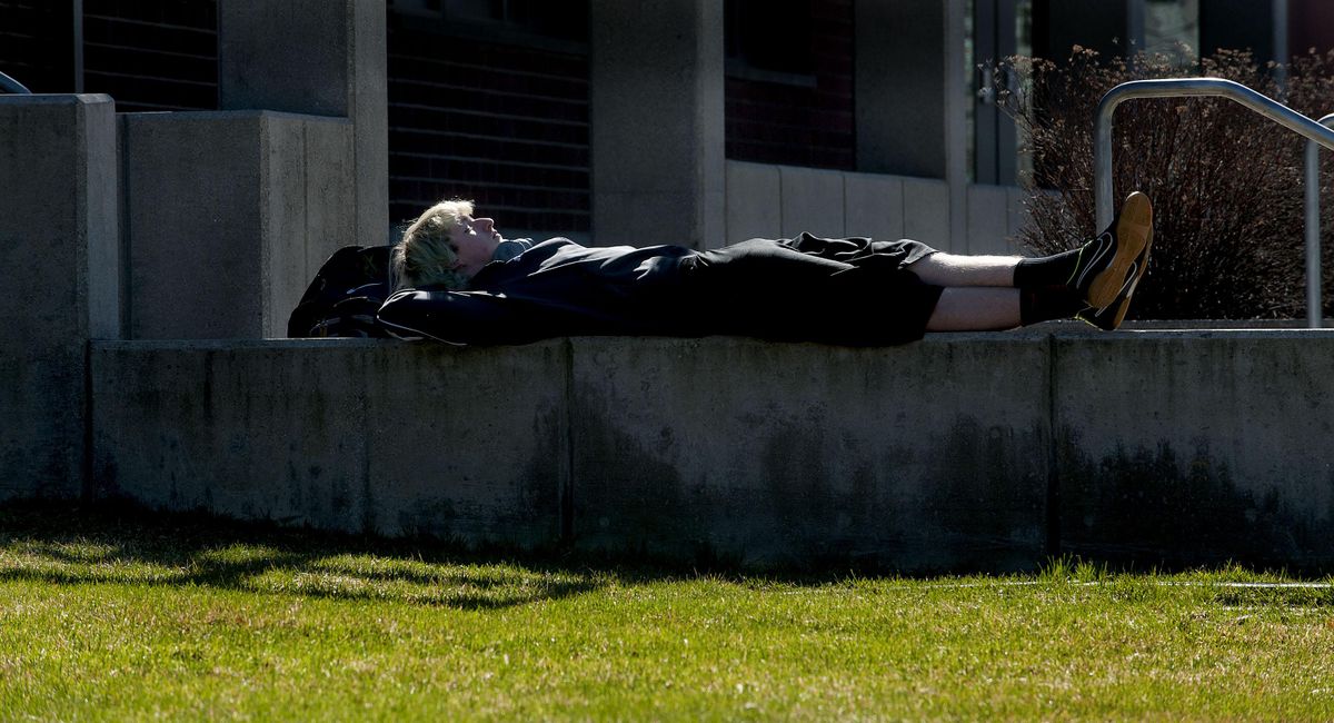 West Valley High School sophomore Cory Hatten spends his lunch period lounging in the sun on Wednesday, March 16, 2016. (Kathy Plonka / The Spokesman-Review)