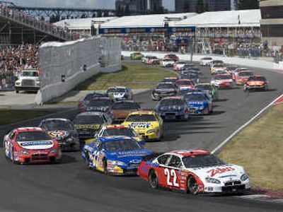 
Associated Press Patrick Carpentier (22), who finished second to Kevin Harvick, leads the pack early in Saturday's Busch race in Montreal.
 (Associated Press / The Spokesman-Review)