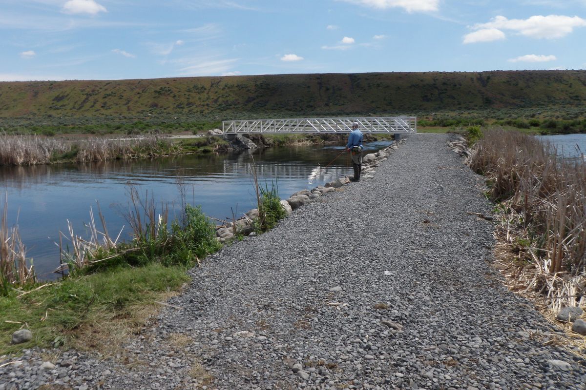 An angler fishes near the new south bridge over Rocky Ford Creek. (Washington Department of Fish and Wildlife)