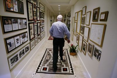 Sen. John McCain, R-Ariz., walks down a hallway in his home in Phoenix, Ariz., in February. McCain said Thursday he wasn’t sure how many houses he and his wife, Cindy, actually own.  (File Associated Press / The Spokesman-Review)