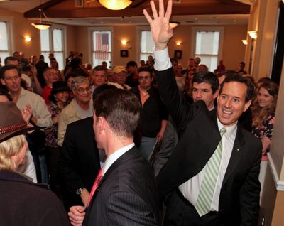 Republican presidential candidate and former Pennsylvania Sen. Rick Santorum waves to supporters at Lookout Steakhouse in Gulfport, Miss., on Sunday. (Associated Press)
