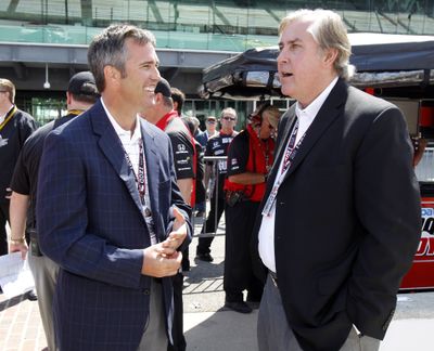 Jeff Belskus, right, CEO of Indianapolis Motor Speedway, and IndyCar CEO Randy Bernard chat. (Associated Press)
