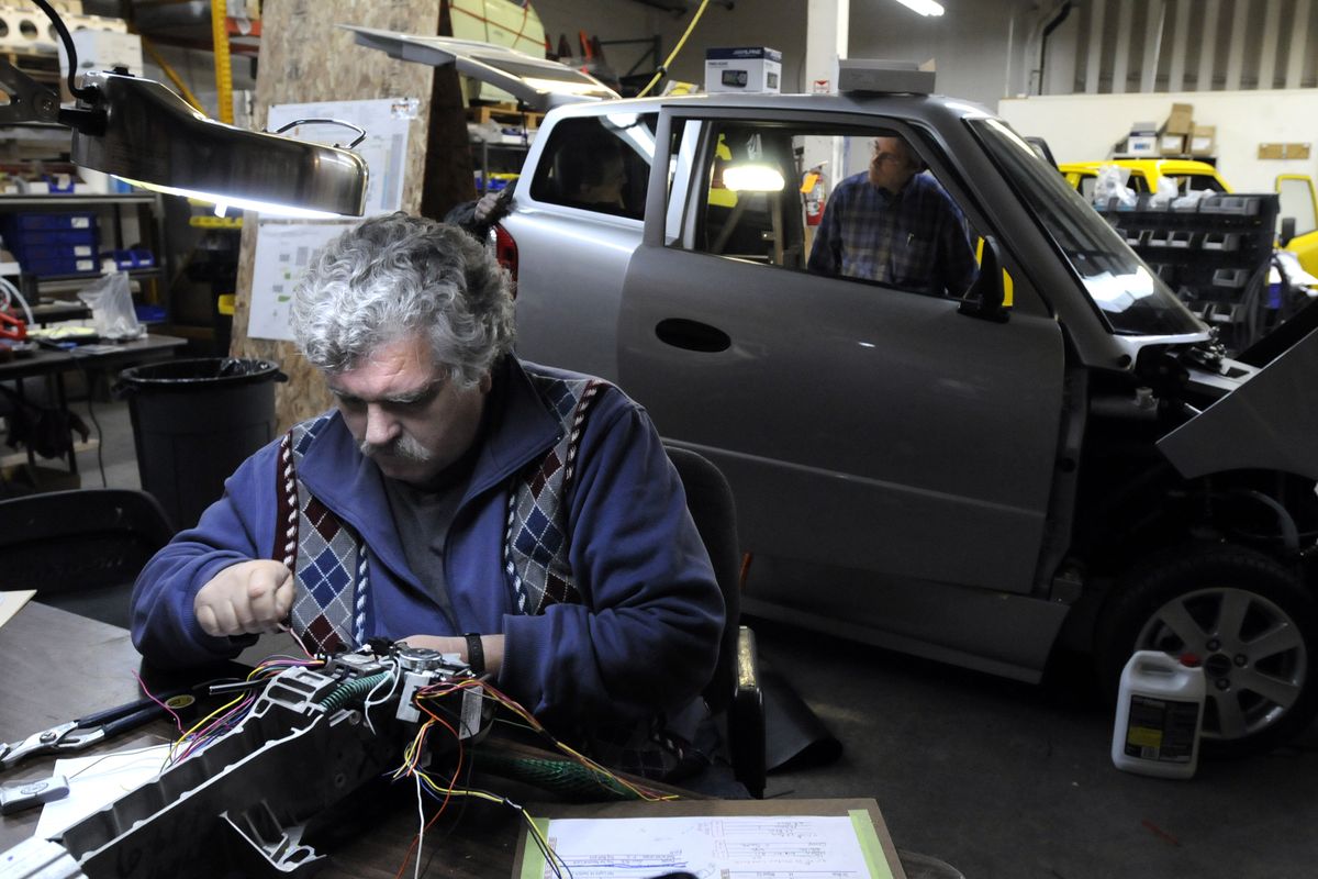 Greg Brown assembles the  steering column and controls for a Tango electric car  Oct. 24, 2008. The company produces a tiny, high-performance electric car that is not much bigger than a motorcycle.  (File)