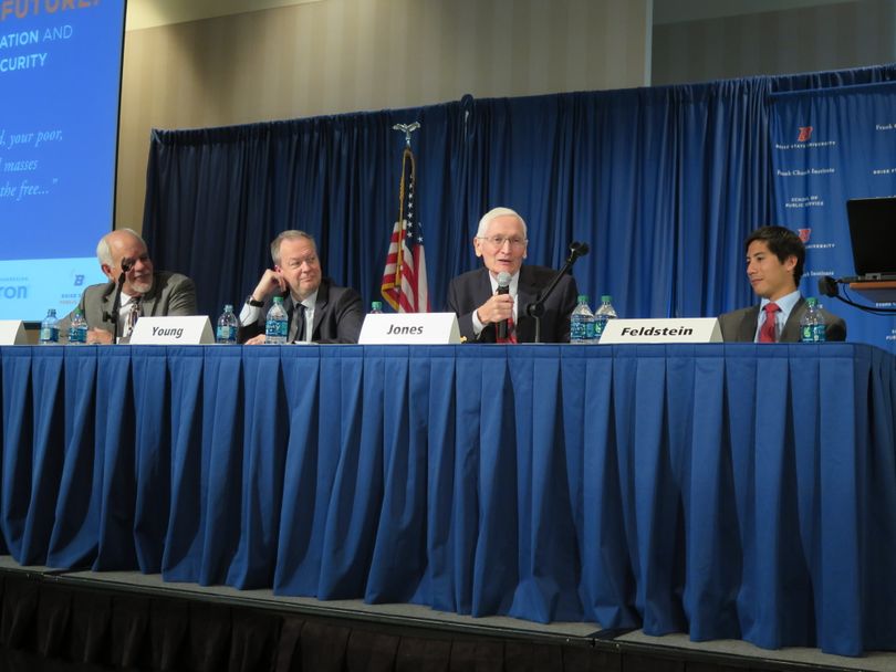 Former Idaho Supreme Court Chief Justice Jim Jones speaks at the Frank Church Conference at Boise State University on Monday, Oct. 23, 2017; also on the panel with him are, from left, Jan Reeves, director of the Idaho Office of Refugees; Michael Young, senior advisor to Mercy Corps; and at right, Steven Feldstein, Frank and Bethine Church Chair of Public Affairs at BSU and a former deputy assistant U.S. secretary of state. (Betsy Z. Russell)