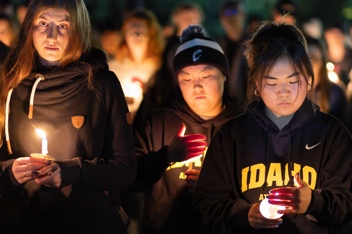 Students listen to a speaker during a candlelight vigil on Monday, Nov. 13, 2023 at the University of Idaho in Moscow. The vigil was held to remember UI students Ethan Chapin, Xana Kernodle, Madison Mogen and Kaylee Goncalves on the one-year anniversary of their deaths.  (Geoff Crimmins/For The Spokesman-Review)